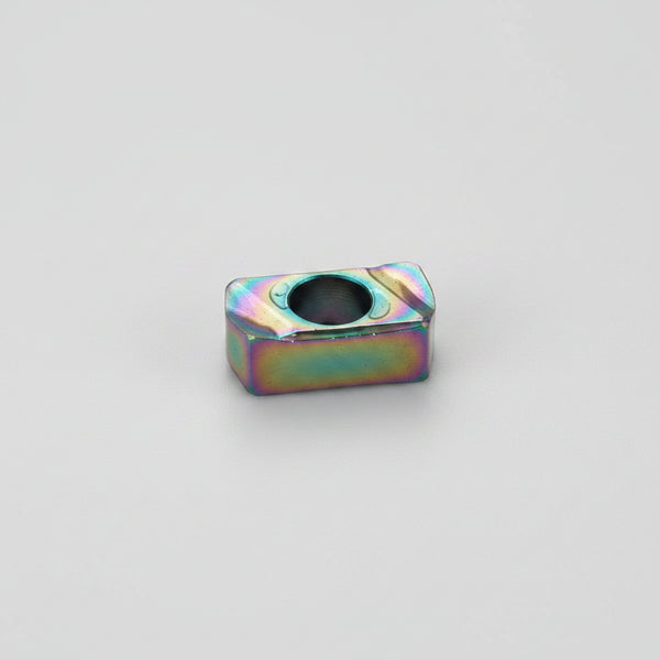 LNMU 0303 coated carbide milling insert with a rectangular design, central mounting hole, and rainbow PVD coating on a white background.